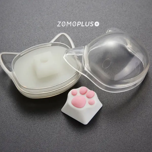 zomoplus-abs-silicone-kitty-paw-artisan-keycap-and-storage-box ZOMOPLUS White-Pink Kitty Paw Keycap offers a realistic feel, ABS base, and comes with a playful, cat-face storage box for display and safekeeping.
