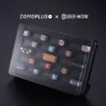 zomoplus-bugerwork-metal-keycap-storage-box-with-high-angle-vertical-display High-angle vertical display of keycaps in the ZOMOPLUS x BurgerWork Metal Storage Box with detachable feet