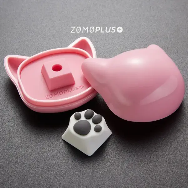 zomoplus-abs-silicone-kitty-paw-artisan-keycap-and-storage-box-white-grey ZOMOPLUS white-grey kitty paw keycap displayed alongside its cat-themed storage box, ideal for keyboard enthusiasts.