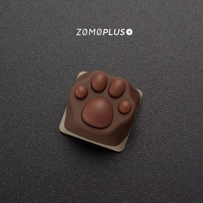 Intricate details of the ZOMOPLUS Siamese Cat Paw Keycap, showcasing its softness and unique color patterns.