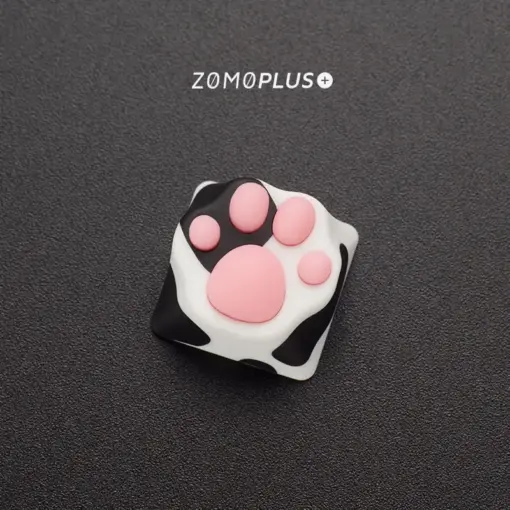 Up-close view of the adorable Tuxedo Cat paw keycap from ZOMOPLUS, emphasizing its vibrant colors and soft touch.