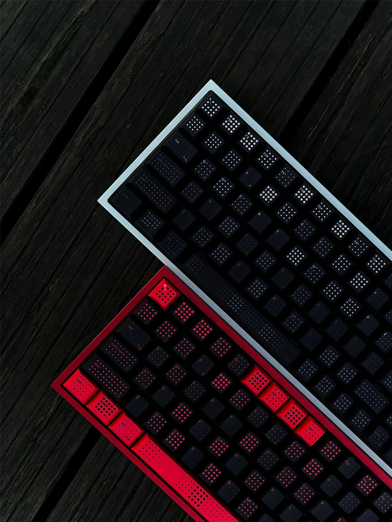 Close-up view of SINOKEY Polka Dot Keycap Sets in red-black and black, installed on keyboards for detail display.