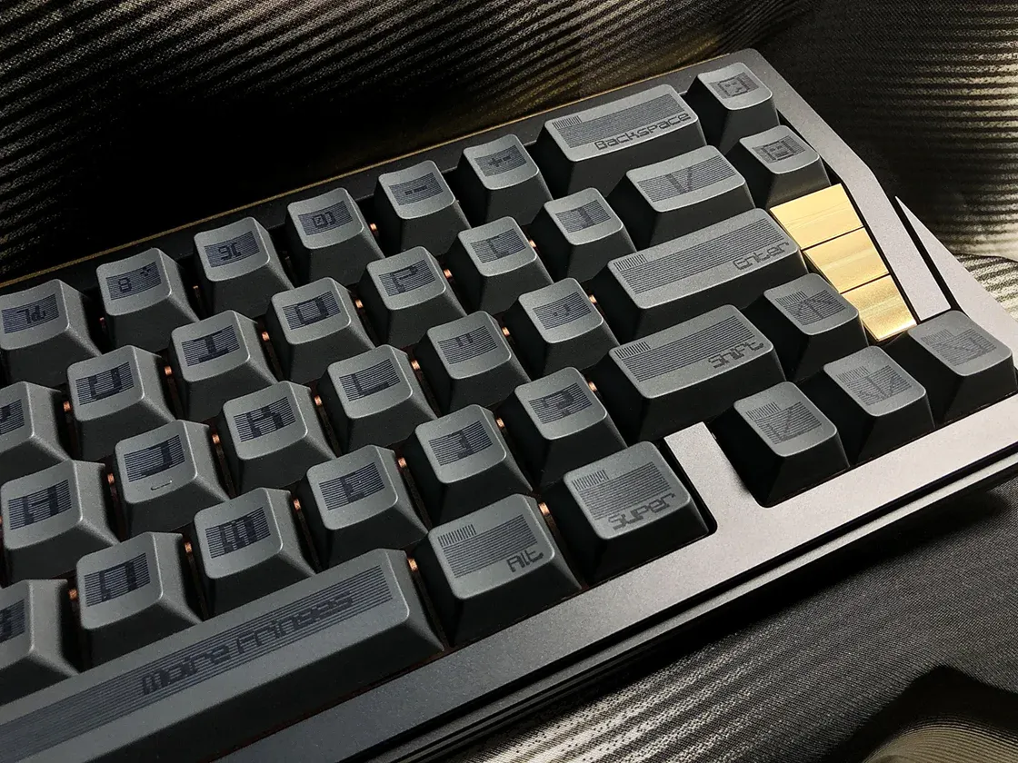 SINOKEY Moire Pattern PBT Black Retro Keycap Set Industrial-style black keycap set with geometric moire pattern and sharp edges.