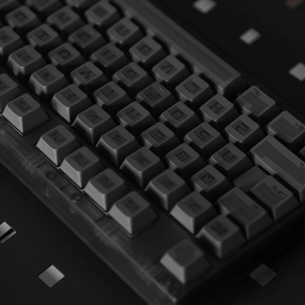 Black PBT keycaps with subtle striped texture and typographic fusion design.