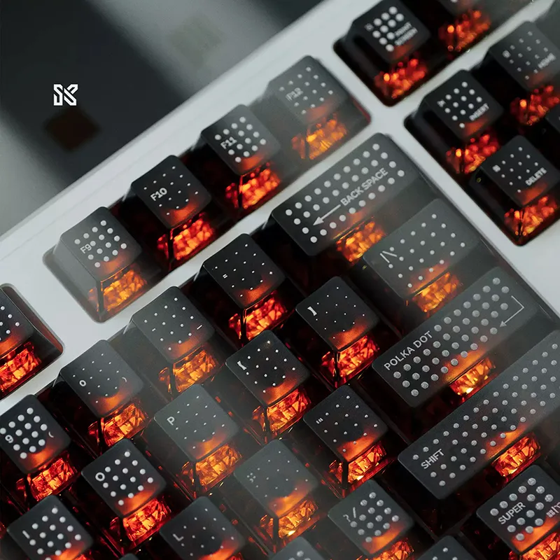 Close-up view of black polka dot keycaps showing detailed light diffusion through translucent PC material design