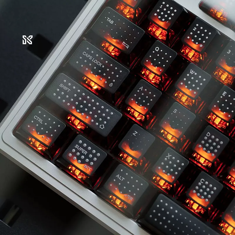 Black polka dot translucent keycaps with bright orange RGB backlighting on mechanical keyboard, premium gaming setup
