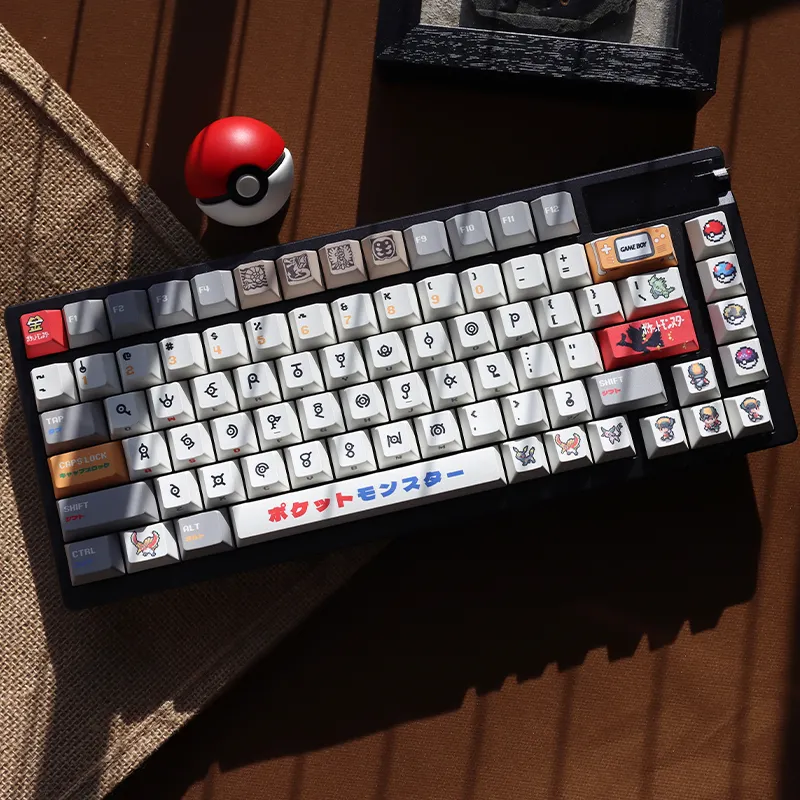 Pokemon Unown keycaps cherry profile keyboard lifestyle shot with Pokeball decoration retro gaming setup