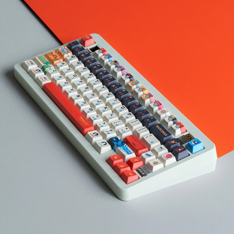 Detailed view of Pokemon keycaps showing anime character artwork and colorful key designs in cherry profile on mechanical keyboard
