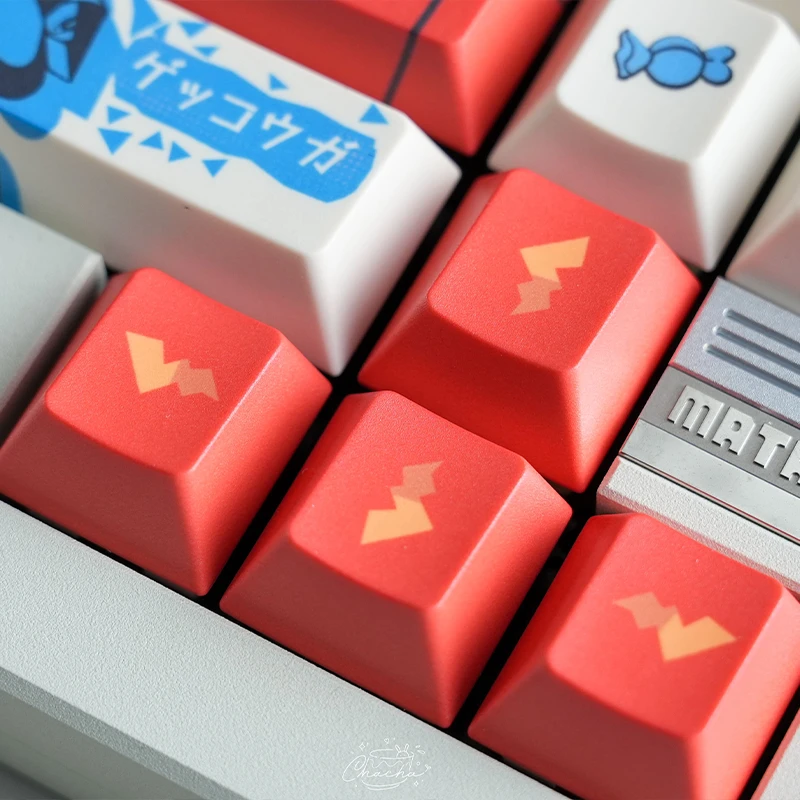 Close-up of Pokemon keycaps showing character silhouettes including Pikachu on coral colored keys with premium dye-sublimation