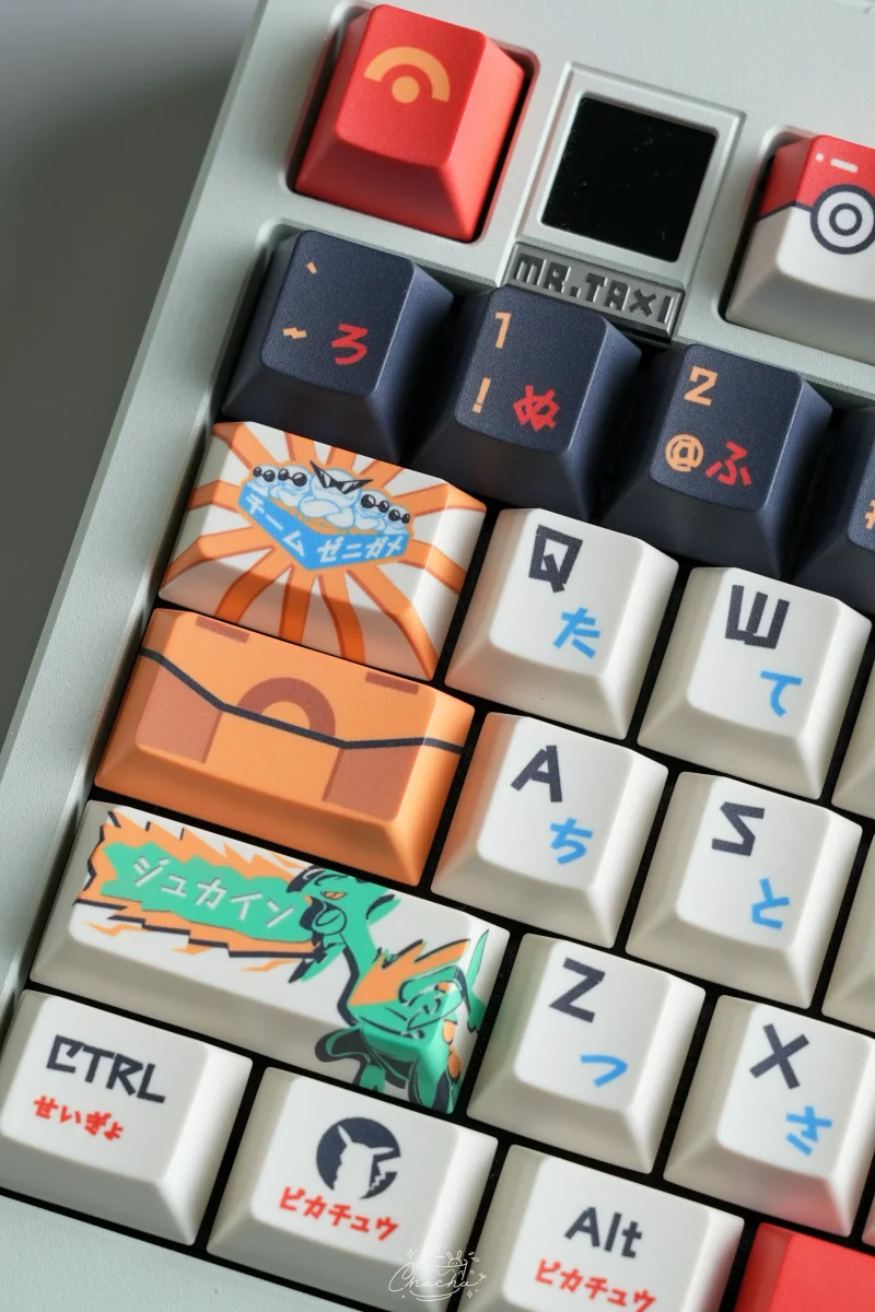 Pokemon Master Cherry Profile Keycaps Macro shot of Pokemon Pokedex artisan keycaps showing detailed multi-key design with orange and teal coloring across keyboard layout