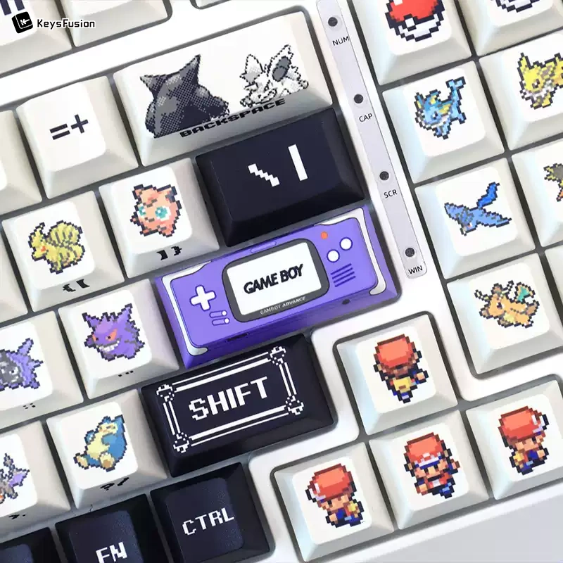 Pokemon keycaps close-up showing purple Game Boy key and pixelated Pokemon characters on Cherry profile keycaps