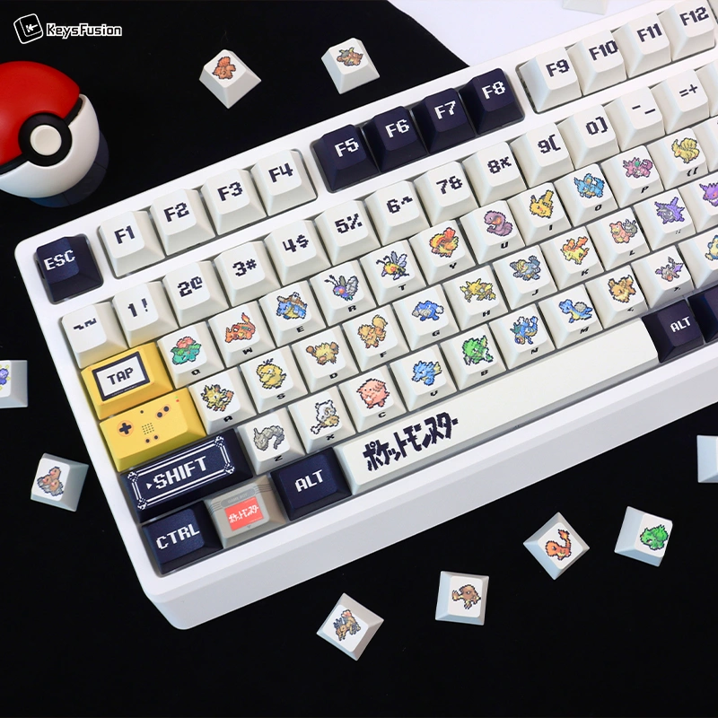 Overhead Pokemon keycap keyboard view with authentic Pokeball prop showcasing retro pixel art design
