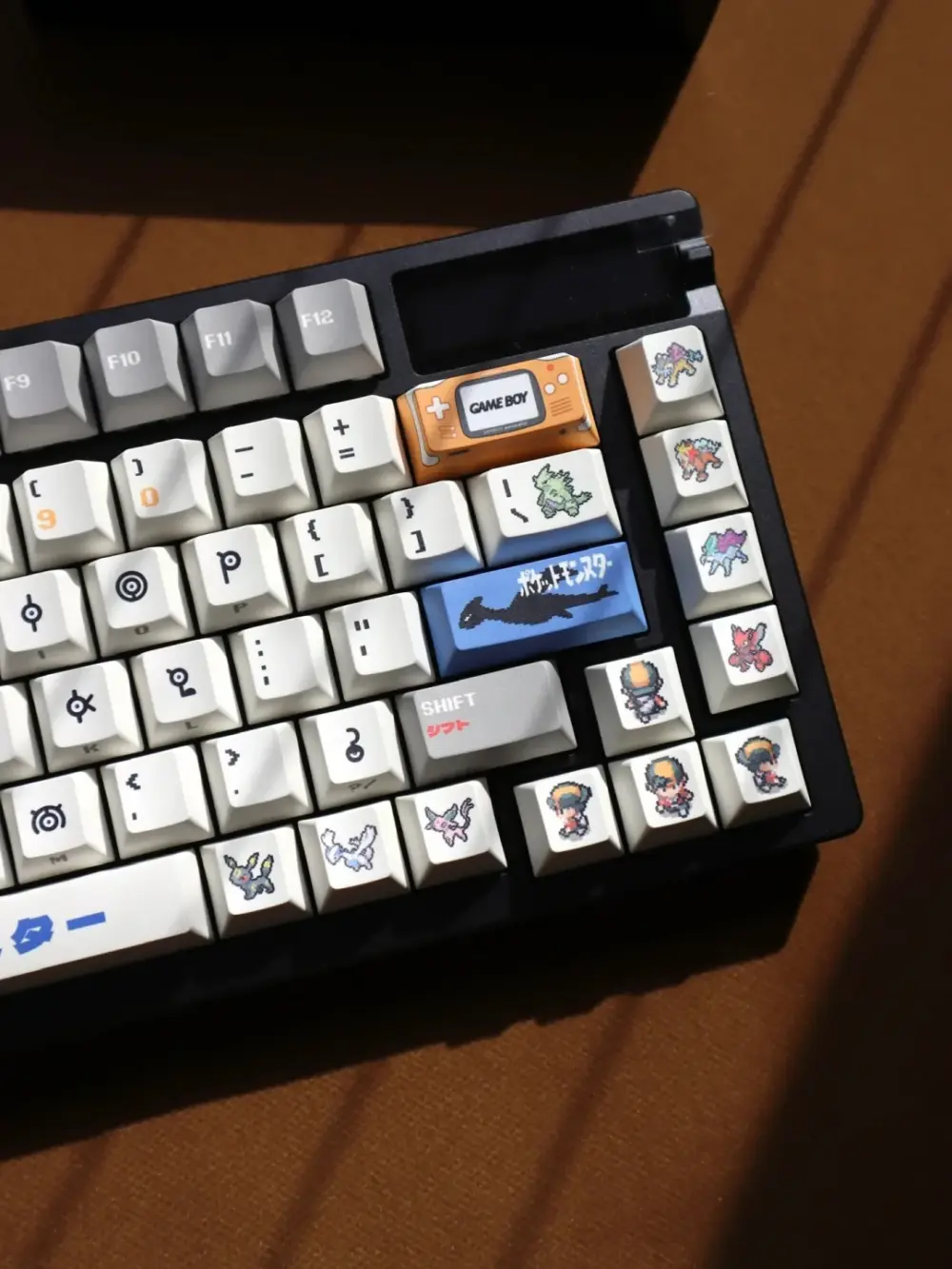 Pokemon Unown keycaps showing Game Boy accent key and Lugia legendary Pokemon design cherry profile detail