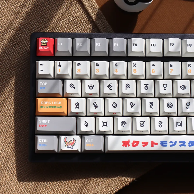 Pokemon Unown keycaps closeup showing authentic alphabet symbols from Generation 2 games cherry profile