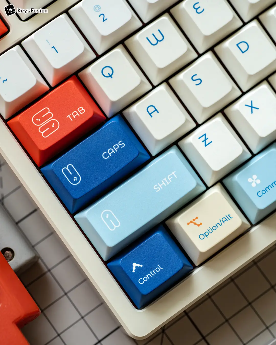 SINOKEY White Rabbit Cherry Profile Keycaps Close-up of SINOKEY White Rabbit Cherry keycaps left modifier section showing red Tab and blue Caps Lock keys