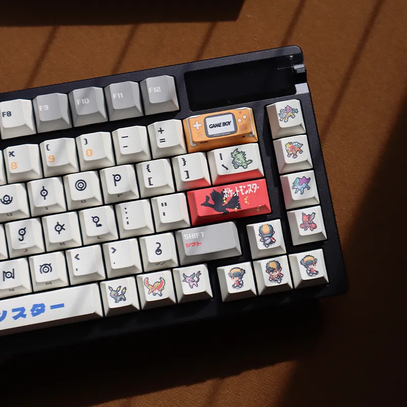Pokemon Unown keycaps detail showing Game Boy accent key and legendary Pokemon characters cherry profile