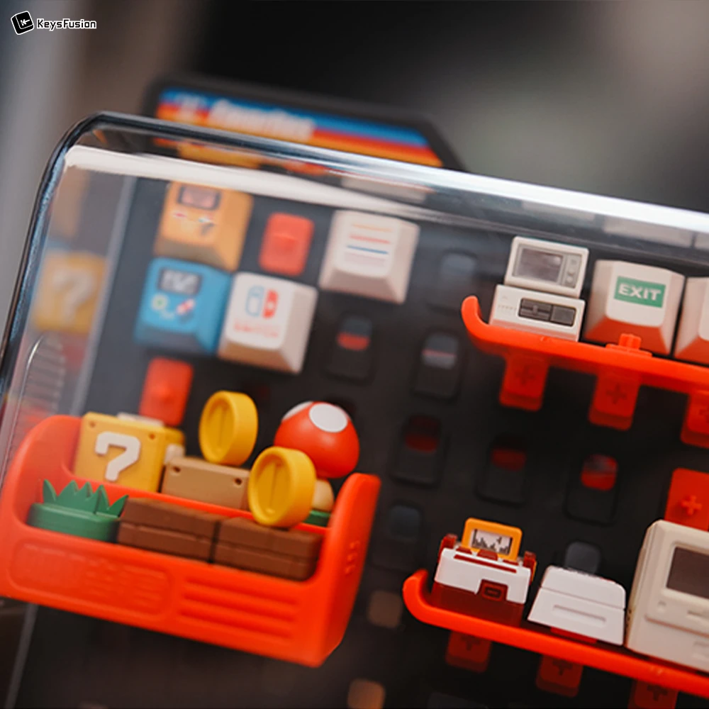 Premium Keycap Display Case | Retro Gaming Collection Organizer Close-up of vertical keycap pegboard display showing detailed arrangement of gaming-themed artisan keycaps with dust protection.