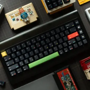 Rainbow Dot Cherry Profile Keycaps in black with green spacebar and retro gaming setup