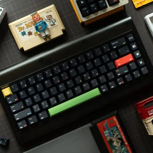 keysfusion-rainbow-dot-cherry-profile-keycaps-black-1 Rainbow Dot Cherry Profile Keycaps in black with green spacebar and retro gaming setup