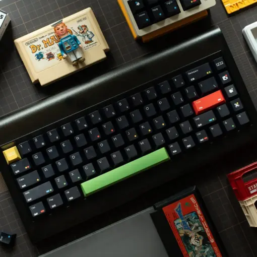 keysfusion-rainbow-dot-cherry-profile-keycaps-black-1 Rainbow Dot Cherry Profile Keycaps in black with green spacebar and retro gaming setup