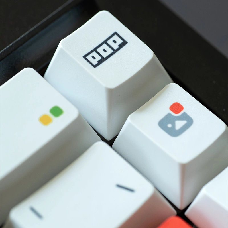 Close-up white modifier keycaps with rainbow dot accents and premium PBT construction
