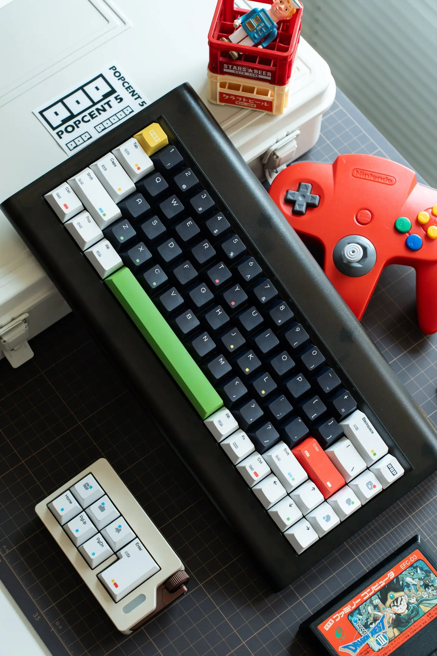 Black and white keycaps keyboard with retro gaming setup and rainbow dot accents