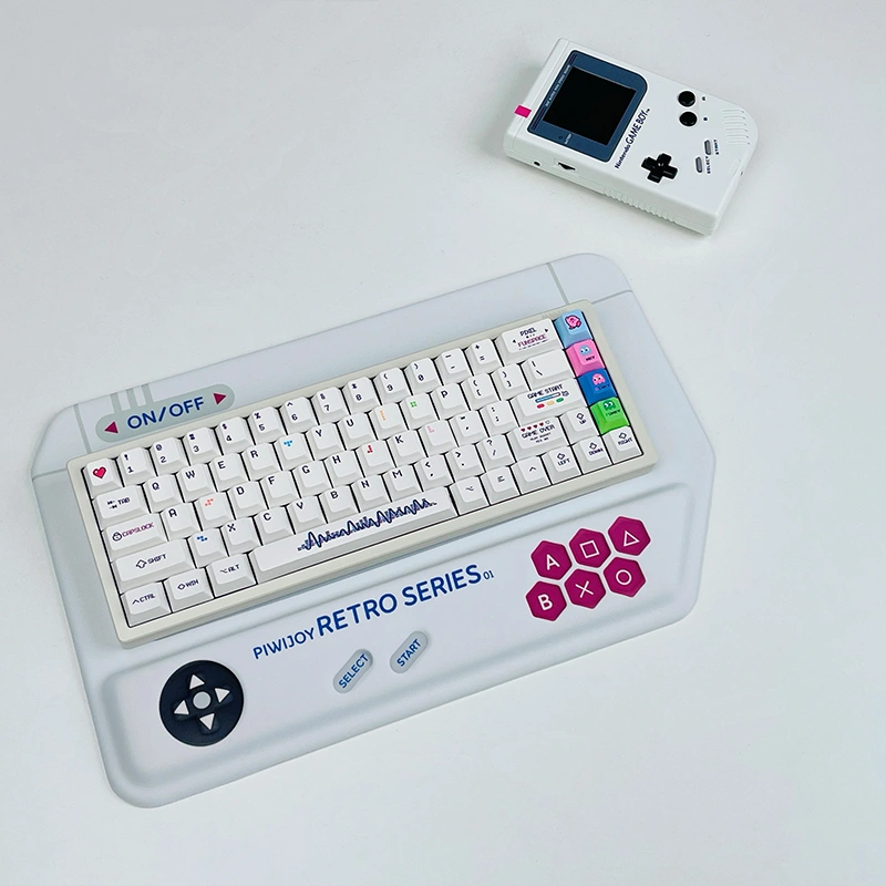White retro game console-styled keyboard wrist rest with mechanical keyboard in classic gaming layout.