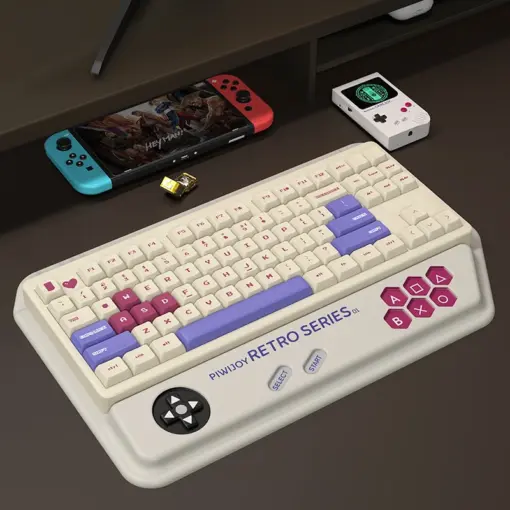 Gaming desk setup showing white retro console keyboard wrist rest for a complete nostalgic setup.