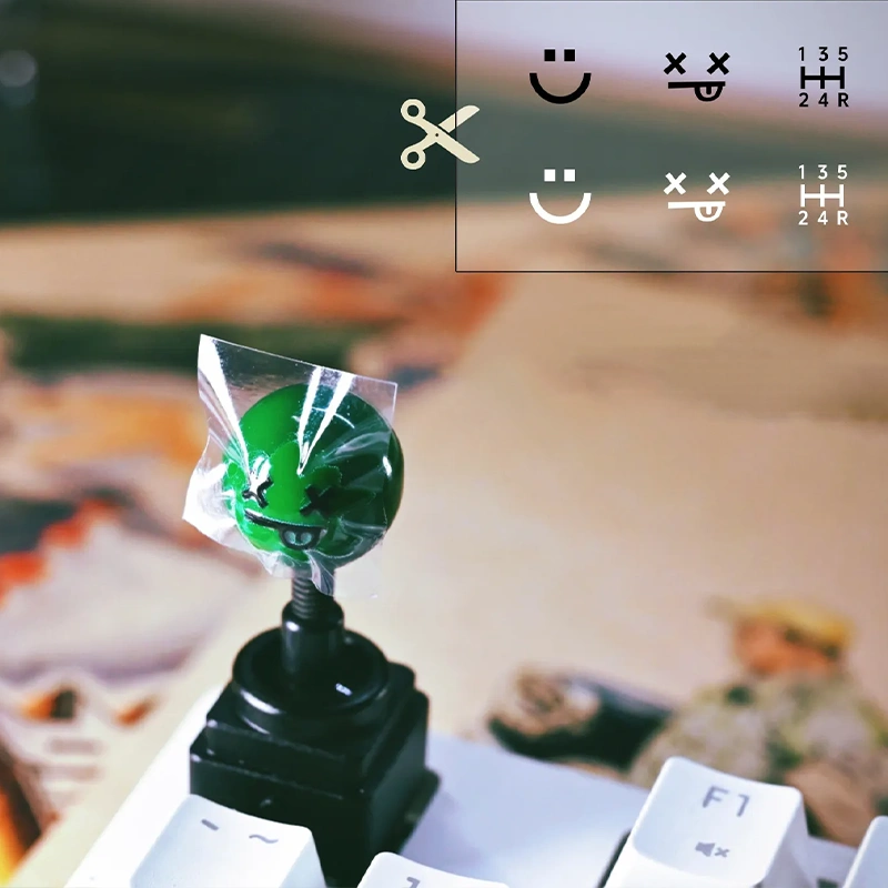 Retro Joystick Metal Artisan Keycap Green joystick ball with crystal decal stickers sheet showing smiley faces and gear shift patterns, DIY guide