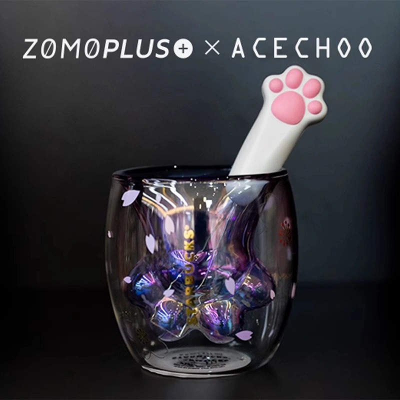 White cat paw keycap puller in iridescent glass with pink paw pads
