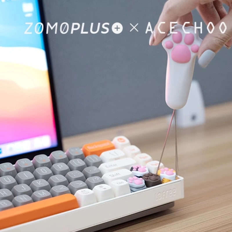 Cat paw keycap puller removing keycaps from mechanical keyboard with cute design