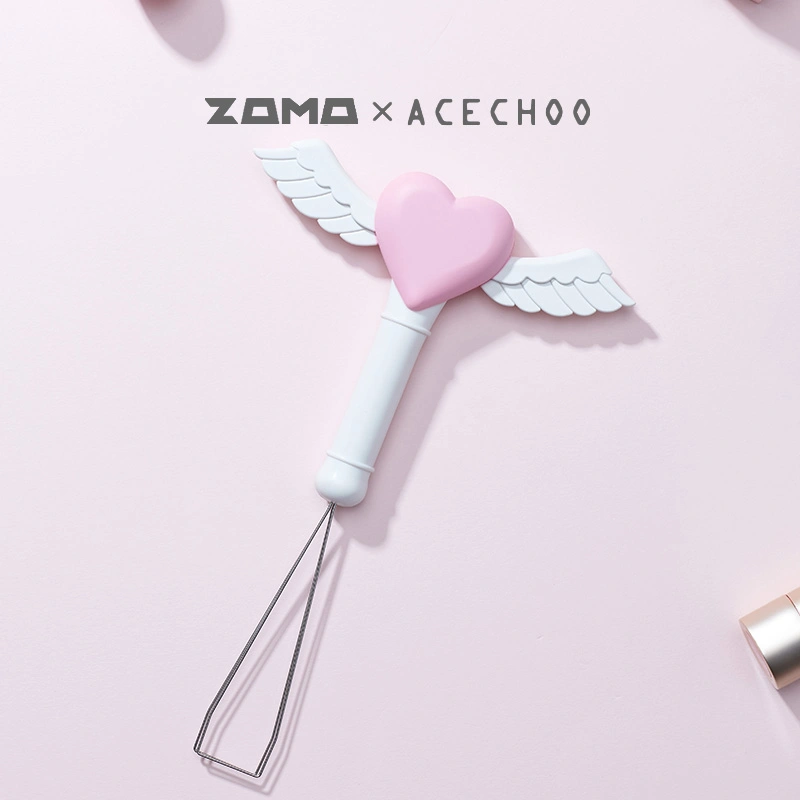 White fairy stick keycap puller with pink heart and angel wings detail