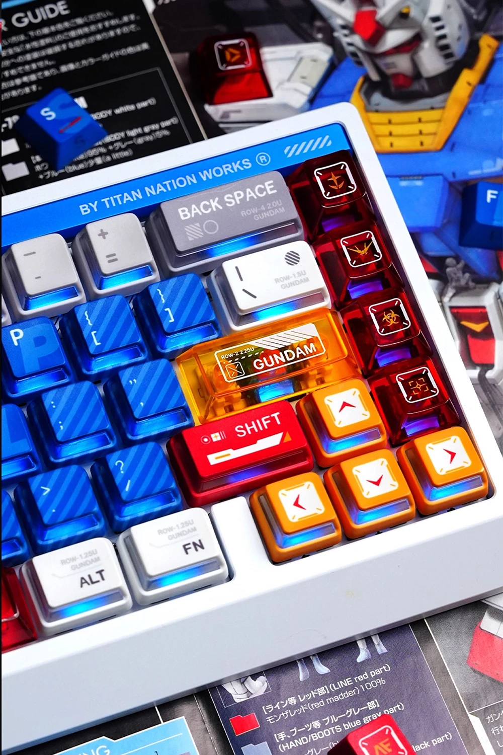 Gundam Nuclear Power & Cherry Profile Side-lit Keycaps Gundam Nuclear Power side-lit keycaps on mechanical keyboard featuring blue translucent keys, red shift key, orange accent caps with RGB illumination and mecha emblems