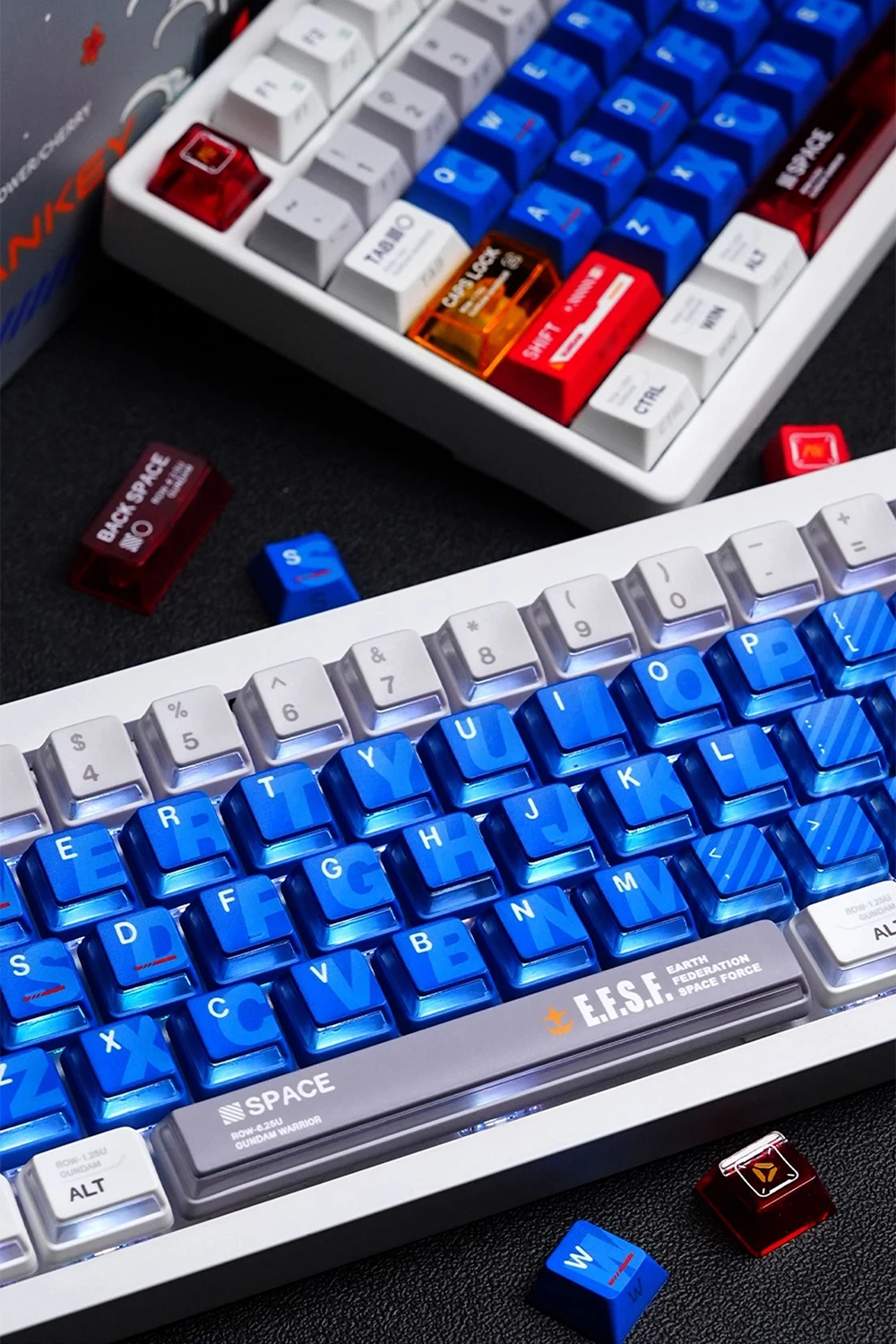 Gundam Nuclear Power & Cherry Profile Side-lit Keycaps Two Gundam Cherry profile keyboards displaying blue translucent keycaps, white base keys, E.F.S.F. spacebar branding with red and blue accent caps
