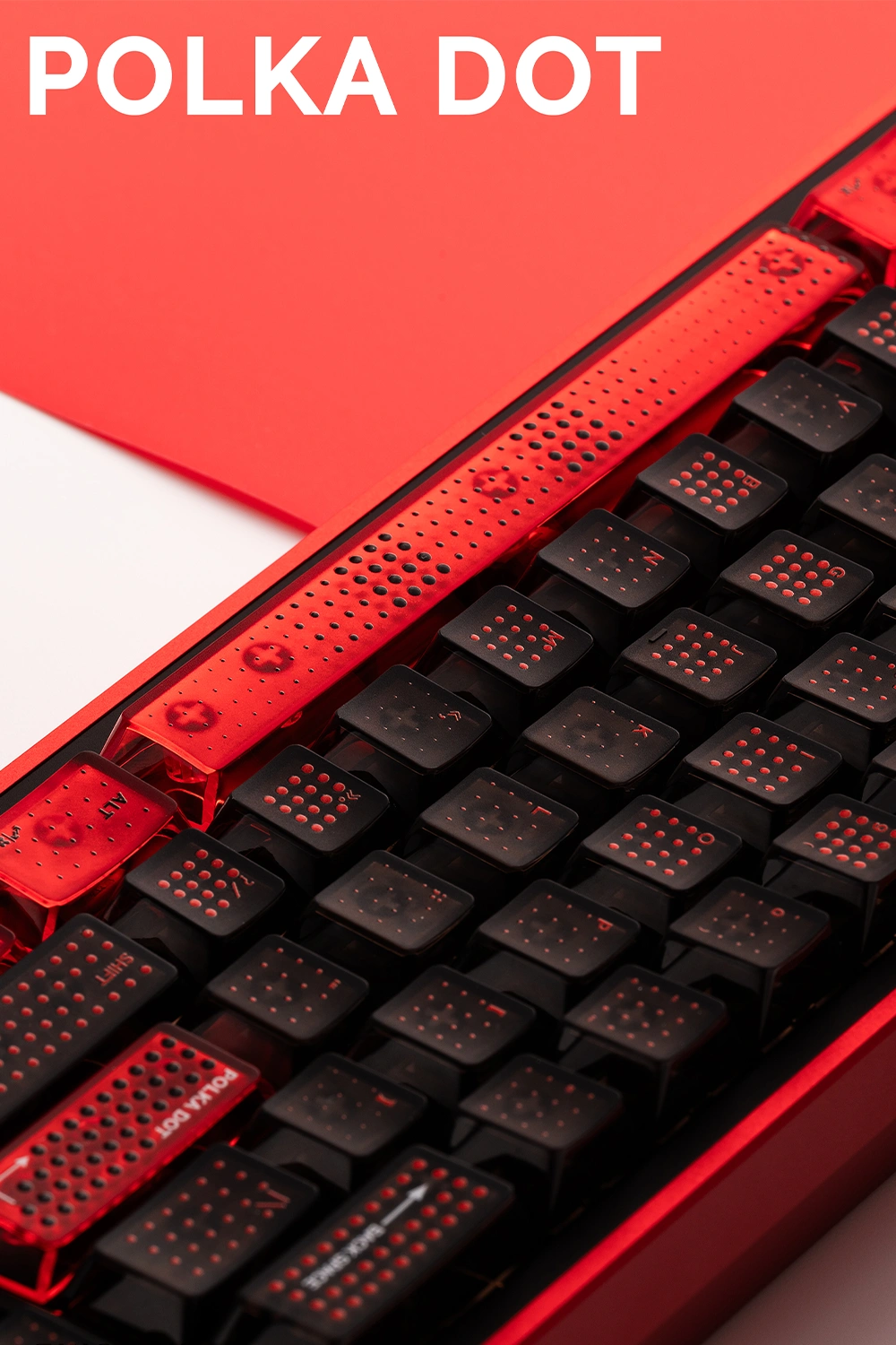 Red translucent spacebar with polka dot pattern on black Cherry profile keyboard