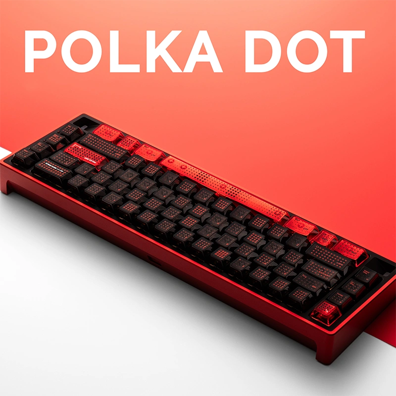 Angled view red and black translucent polka dot keyboard with raised texture