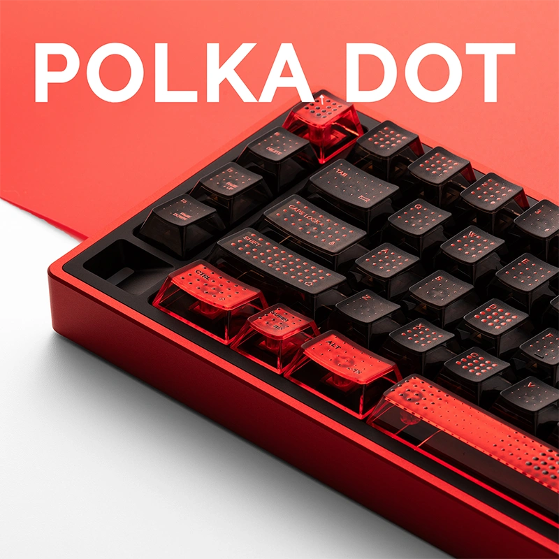 Side angle red-black polka dot keyboard showcasing translucent keycaps and red frame