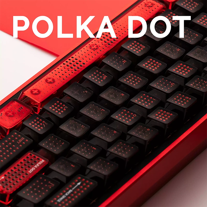 Detail shot red translucent spacebar and black keycaps with polka dot texture