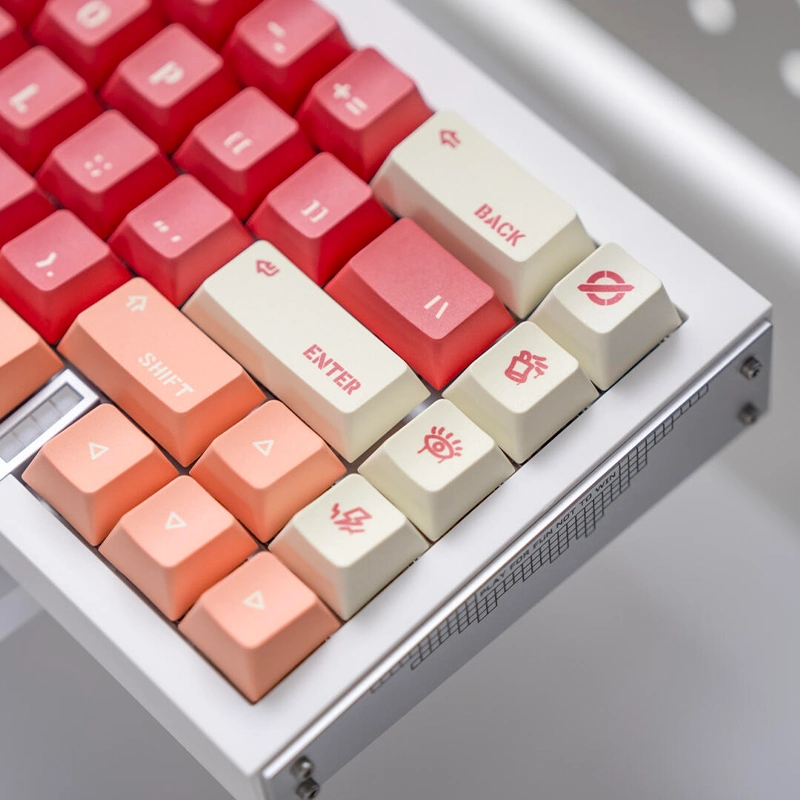 Red gradient keycaps with cream Enter key showing brick-inspired terracotta tones closeup