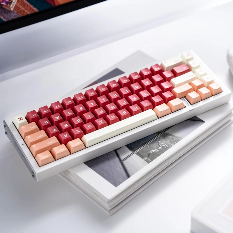 Compact red gradient keyboard with terracotta and cream keycaps