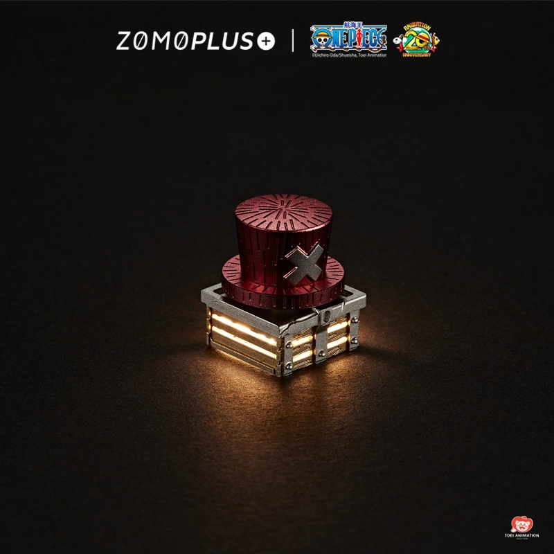 ZOMOPLUS One Piece Chopper pink aluminum artisan keycap with rotating hat and illuminated wooden base on black background