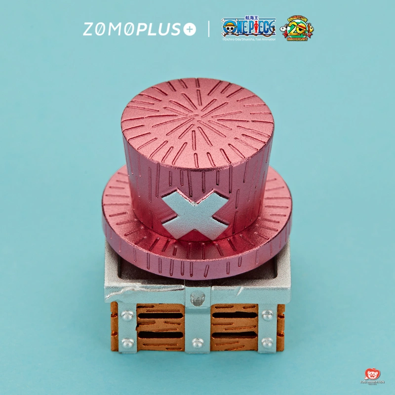 Front facing One Piece Chopper keycap showing pink striped hat with white cross emblem on wooden treasure chest base