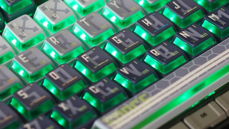 Nuclear Power Profile Keycaps: The RGB Innovation Guide (2026) Close-up of green backlit Nuclear Power Profile keycaps showing uniform glow through frosted PC layer