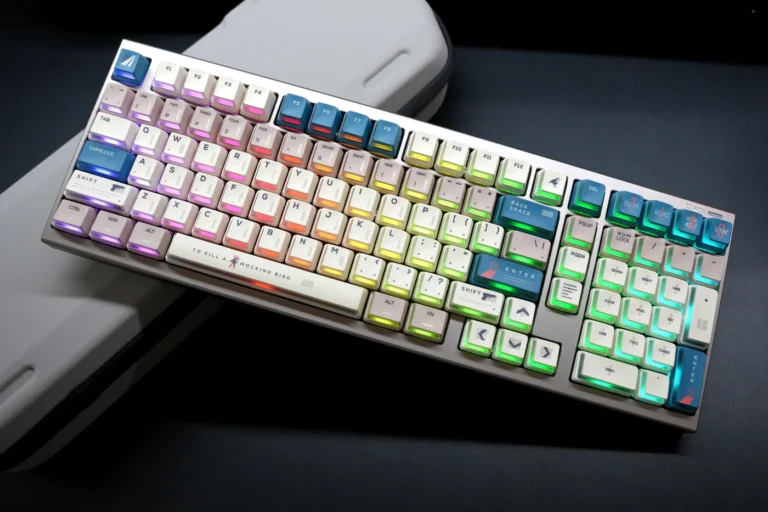 Full keyboard with Nuclear Power Profile keycaps showing rainbow RGB underglow and sculpted profile on white case