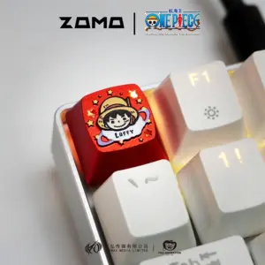 ZOMOPLUS One Piece Chibi Luffy metal artisan keycap in red aluminum with backlit glow on mechanical keyboard