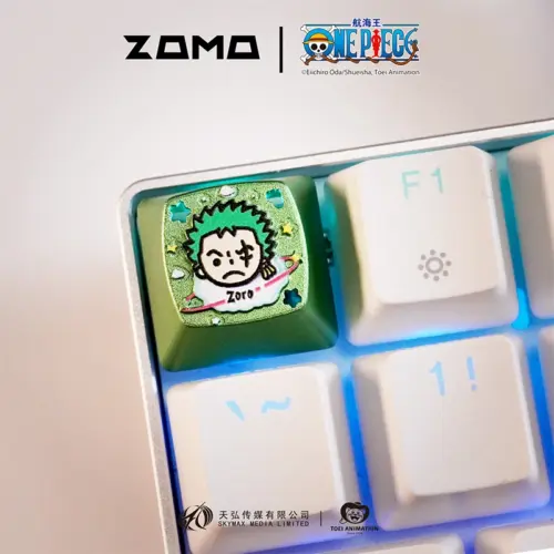 ZOMOPLUS One Piece Chibi Zoro metal artisan keycap in green aluminum with blue backlit glow on mechanical keyboard
