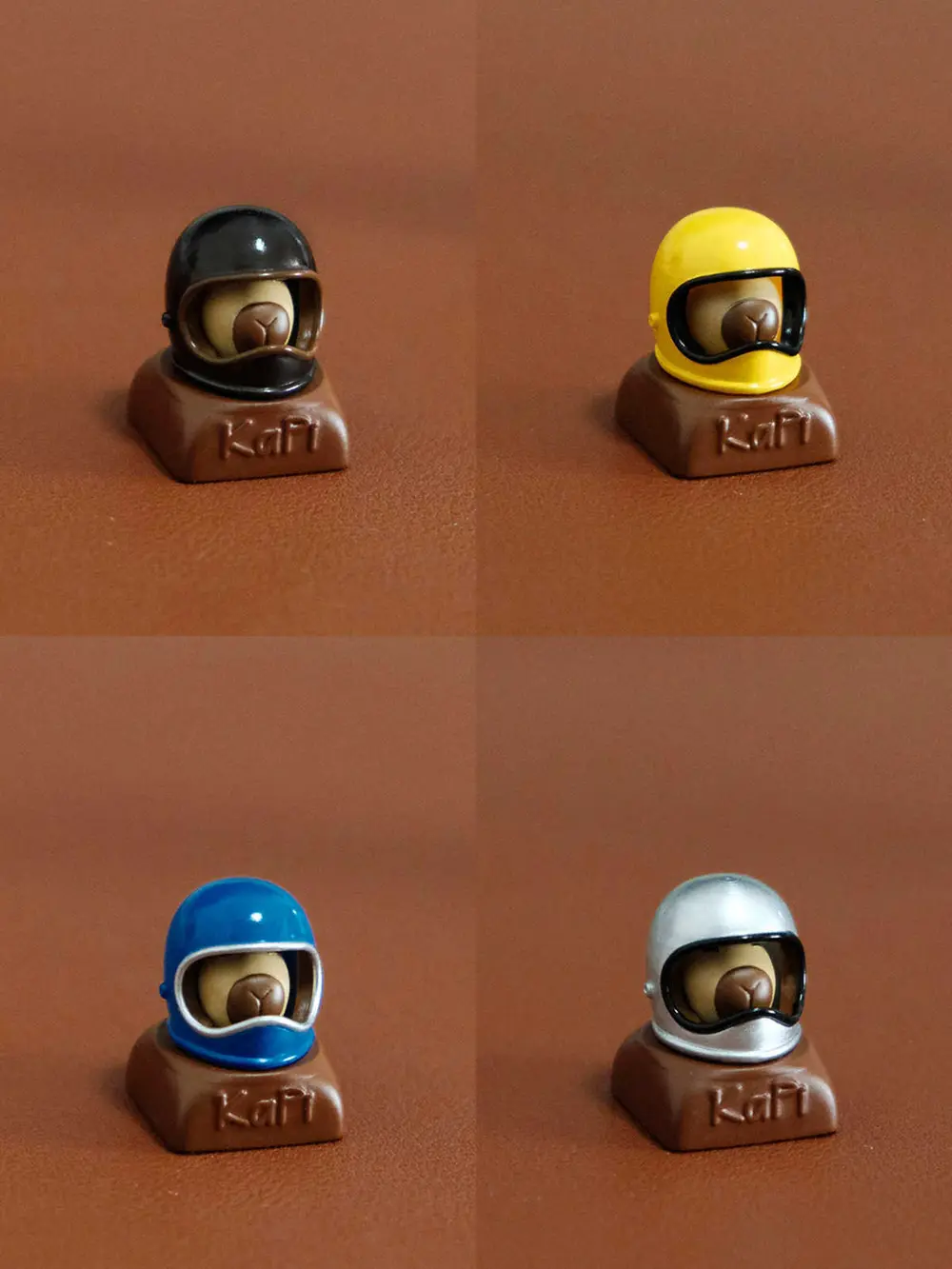 Cute Helmeted Capybara Magnetic 3D Printed Custom Resin Keycaps Custom resin keycaps showing a capybara wearing different colored helmets with Kapi text on the brown base.