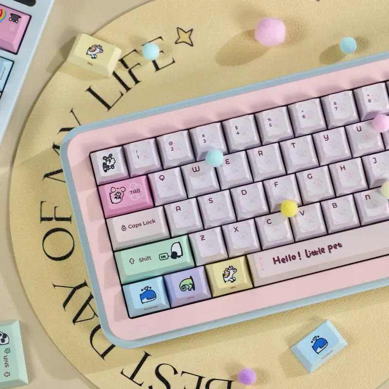 Pink keycaps set on a keyboard featuring a spacebar with text and colorful modifiers with cute cartoon animal graphics.
