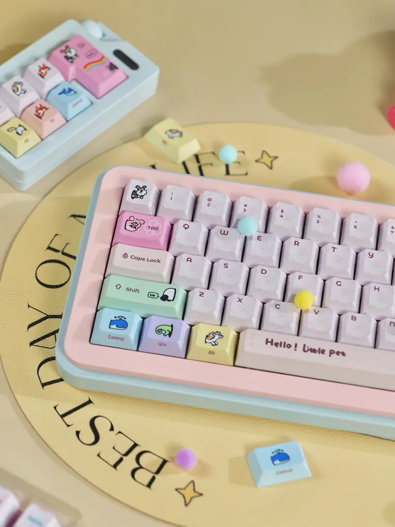 Cute Cartoon Pet Pink Cherry Profile Keycaps Angled view of Pink Keycaps with whale, chameleon, and unicorn illustrations on a pink case keyboard.