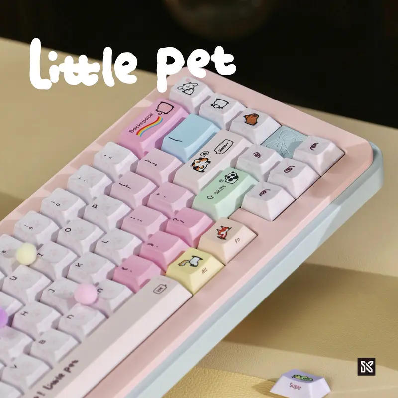 Side view of cute cartoon pet pink keycaps showing pastel colors and animal icons on modifier keys.